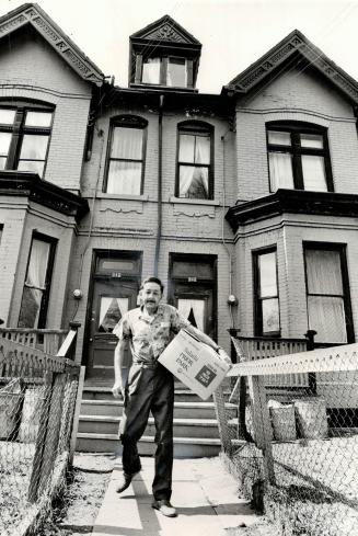 Evicted for the fifth time in a year, Charlie Rolfe, who's 47 and disabled, carries some things out of his downtown rooming house. It has been sold to(...)