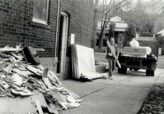 Worth a pile: Piles of refuse at housing sites - like this one full of drywall scraps and an old kitchen sink - can mean money to salvagers