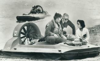 Hovercraft trainees, Training to be hovercraft operators are Christine Nakimura and Timothy Syke, shown here with their instructor Jim McCurdy