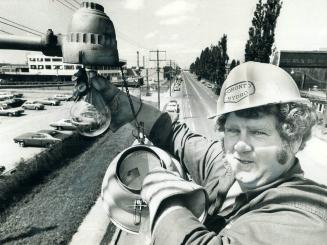 A change of light, Replacing and maintaining lightbulbs in city street lamps is a full-time job for several Toronto Hydro work crews