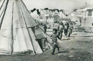 Home from the hunt: There'll be goose meat roasting in the teepees of Fort George, in the centre of town where huts and washing lines are scattered higgledy-piggledy