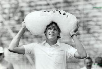 Cool head: Rob Macdonald has the enviable job of carrying ice to the concession where he works at Exhibition Place