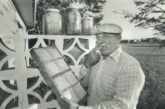 Sweet crop: Ed Dicky samples the produce of his beehives