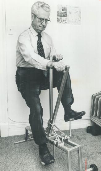 Inventor and former prospector Henry Charbonneau, 78, demonstrates the exercise bicycle he developed that helps both arms and legs. He's hoping to find a manufacturer