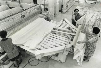 This - Believe It Or Not - Is An Ironing Machine, A Huge sheet ironer - one of four machines designed to handle all the linen ironing for nine co-oper(...)