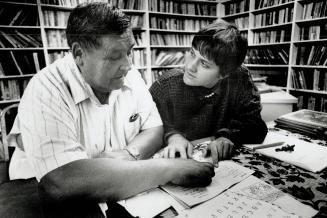 Gus Goulais is tutored by Vera Frantisak at the Council Fire cultural centre, right