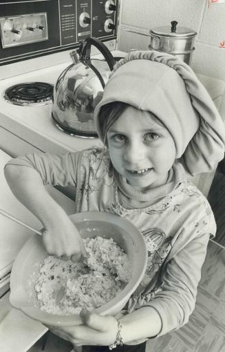 Mixing it up is Angel de Fulvio, 6, who prepared the egg salad for the mini-feast