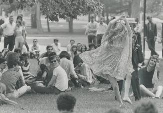 Centre of attention at love-in Queen's Park Dominion Day was scantily-clad Andrea Morgenstern