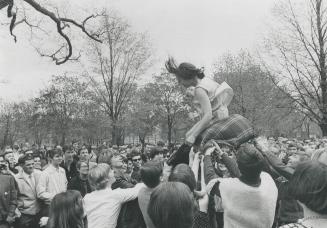 Second girl gets brisker treatment - bounced in a blanket, Love-in had singing, hand-clapping, band music and no arrests