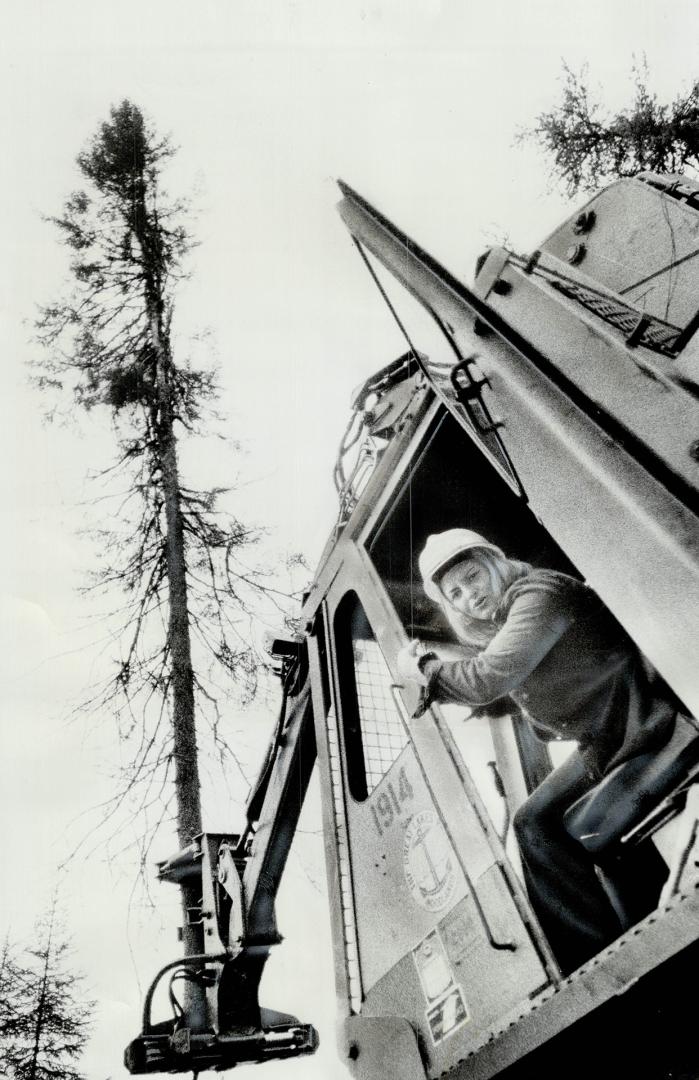 Carolyn Anderson and her 10-ton machine pluck a tree out of the ground without any effort