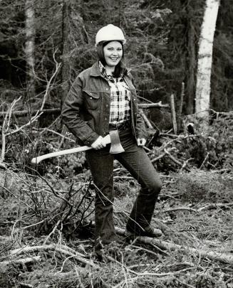 An axe is handy for the woman loggers-but just to keep in shape