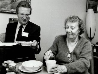 Service with a smile, Edna Weber, 67, of Swansea is surprised to have Toronto Mayor Art Eggleton deliver her meal yesterday day during the Meals on Wh(...)