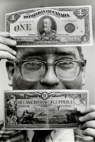 Cash on his mind, Harvey Farrow, president of North York Coin Club, displays two rare prewar bank notes that will be on display at the club's 25th ann(...)