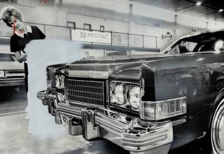 Appraising look is given a 1974 Cadillac by waiters Emma Redzuvatis, who helped serve refreshments yesterday at General Motors Canada's press presenta(...)