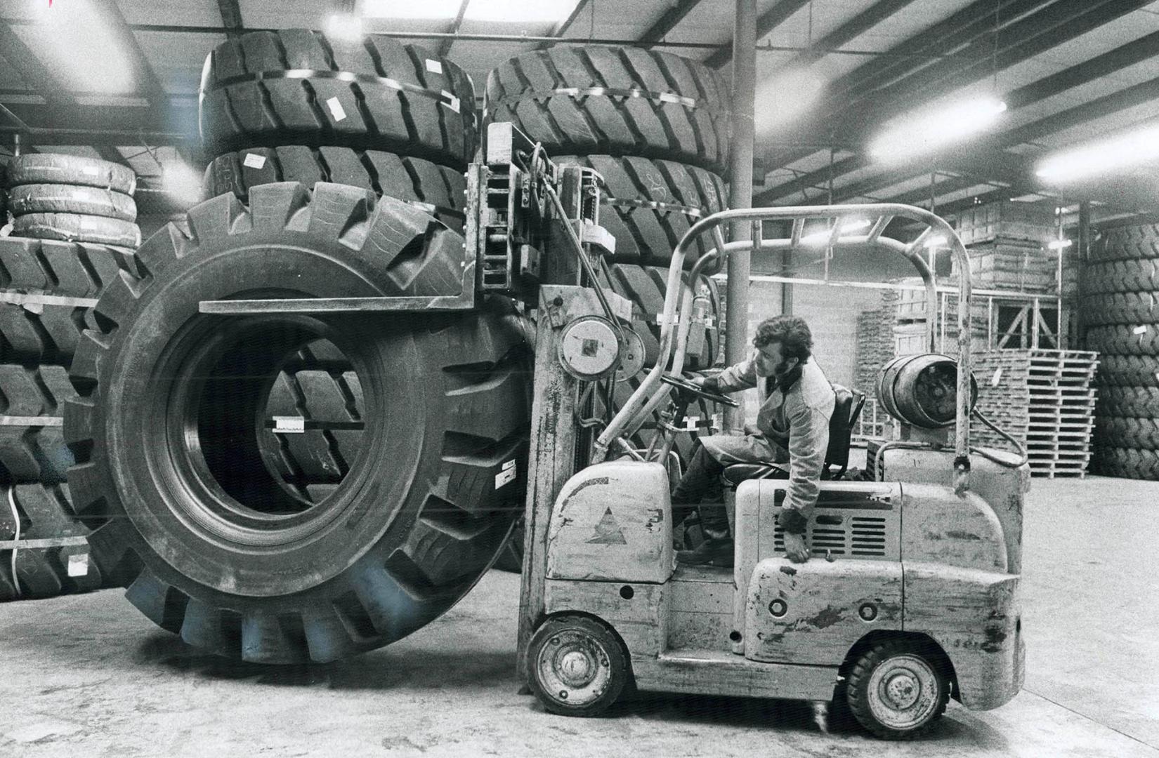 Giant New Tire being transported to United Tire storage area weighs 2,700 pounds and costs about $3,500