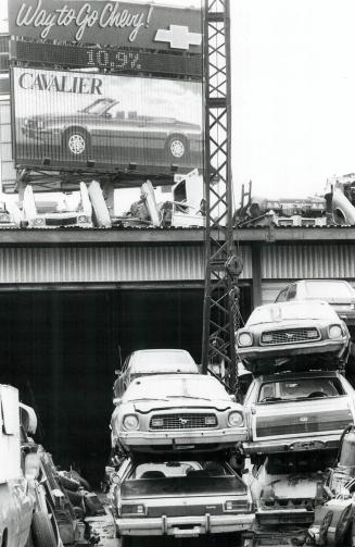 The way of all flash, A Spanking new Chevrolet model is advertised on a billboard, while on Parliament St