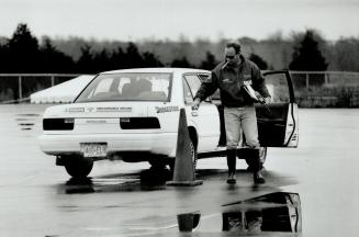 Easy does it: Jeff McKague, an instructor at Nissan School of Performance Driving, judges a competitor's manoeuvre