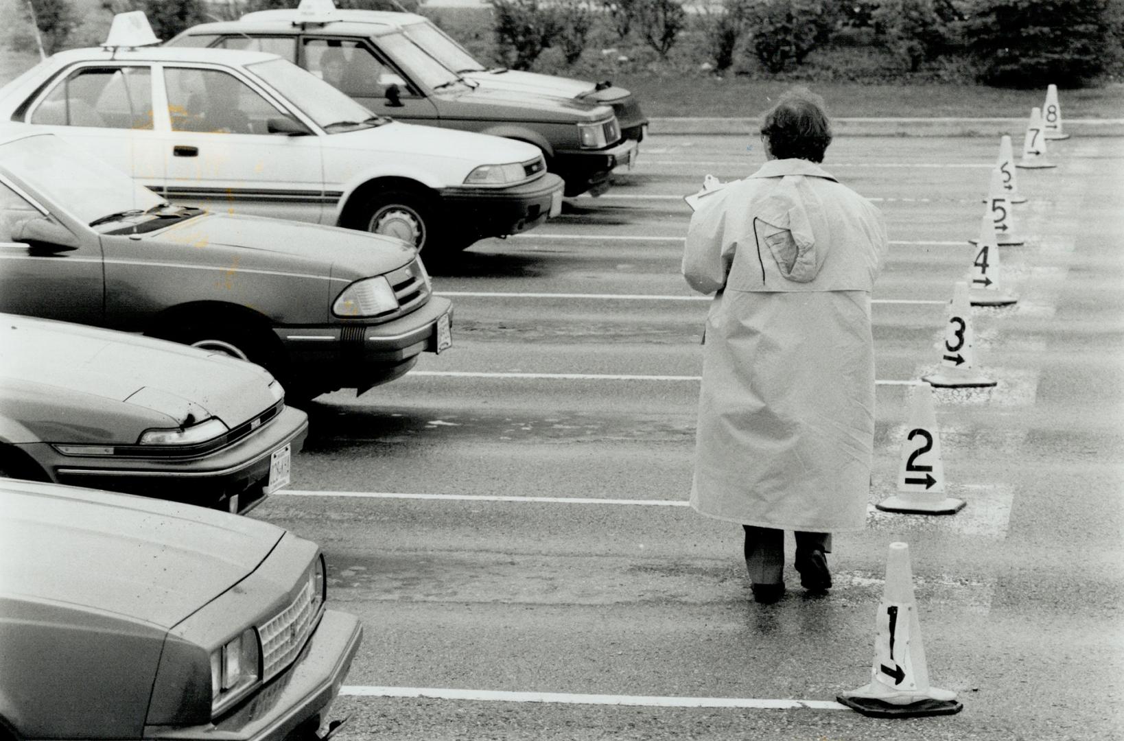 Getting Set: A driving examiner prepares to put an applicant through the paces