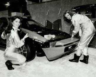 That's some bodywork. Two models bolted the plastic base body of this Pontiac Fiero together in 2 minutes yesterday at the International Centre (home (...)