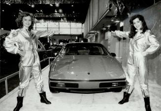 That's some bodywork. Two models bolted the plastic base body of this Pontiac Fiero together in 2 minutes yesterday at the International Centre (home (...)