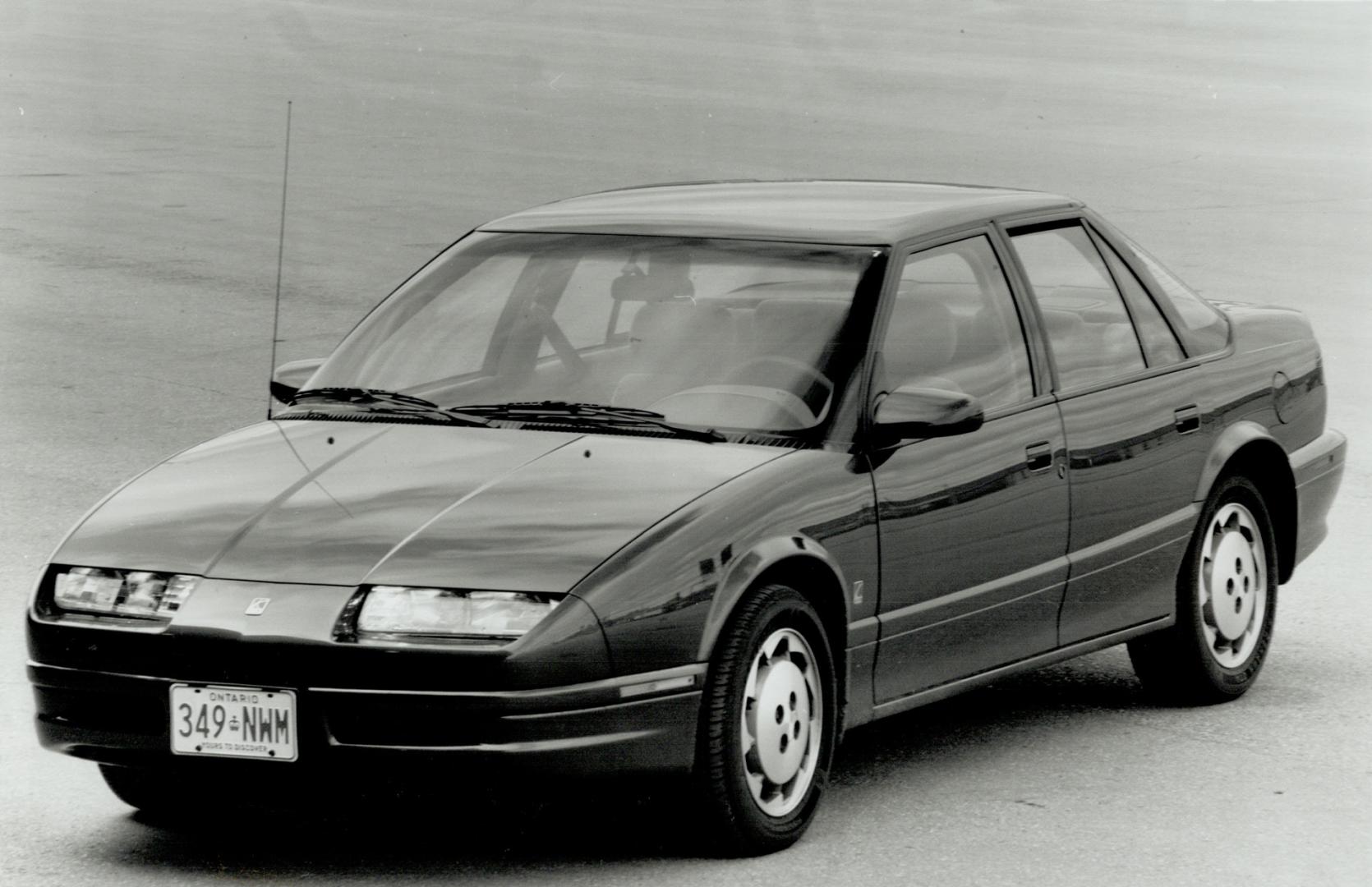 In profile, Saturn's sedan (top and left) looks a great deal like the Olds Cutlass Supreme, which has a pleasing and unique appearance from the rear ((...)