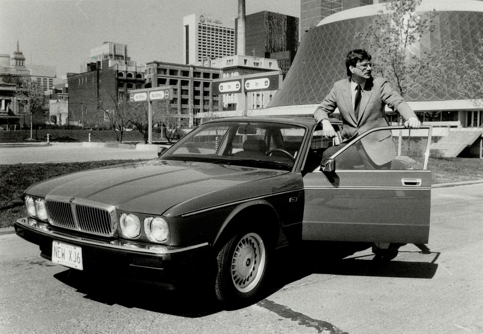 Licence Plate New XJ6 says it all as Jaguar Canada's Jim Robertson shows off the newest cat