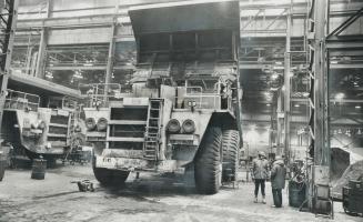 Mining the world's largest sandbox in the Athabasca tar sands is a job for big machines, like this 150-ton truck, and big money, says Sun Oil executiv(...)