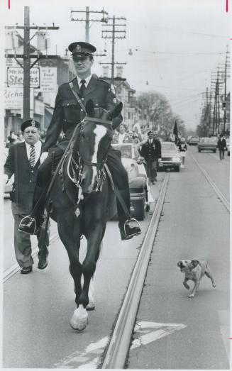 Barking dog doesn't bite, Leading the annual Easter parade along Queen St