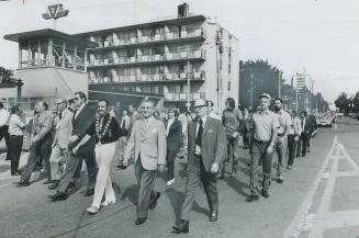 Federal and area leaders marched in yesterday's Labor Day parade through downtown Toronto to the CNE