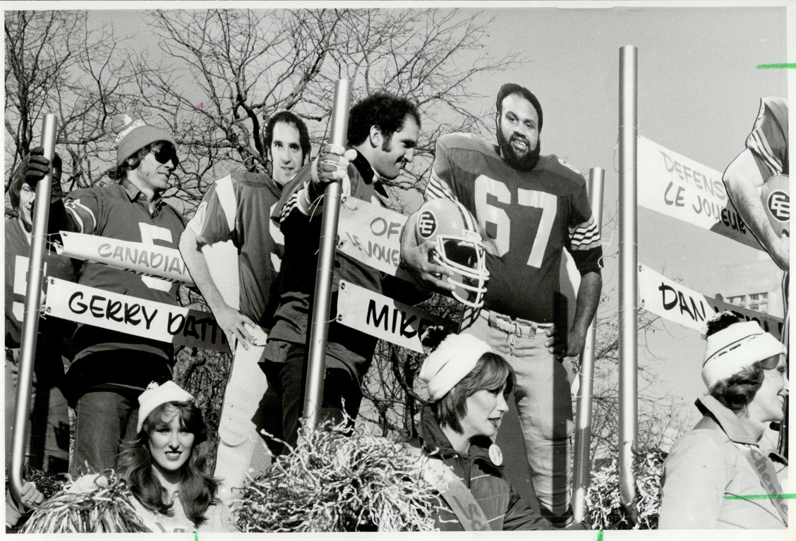 The Real thing Montreal quarterback Gerry Dattilio made a live appearance among the effigies on the Schenley Awards float at yesterday's Grey Cup Para(...)