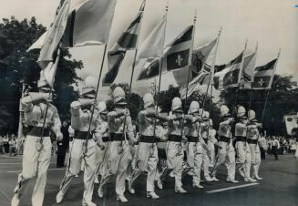 All banners flying, the contingent from France, New Caldonia, Reunion, Tahiti and the Island of Raiatea steps out briskly from Queen's Park at the sta(...)