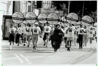 September march: A clown joins in yesterday's Labor Day parade festivities with a contingent representing the Retail, Wholesale and Department Store Union