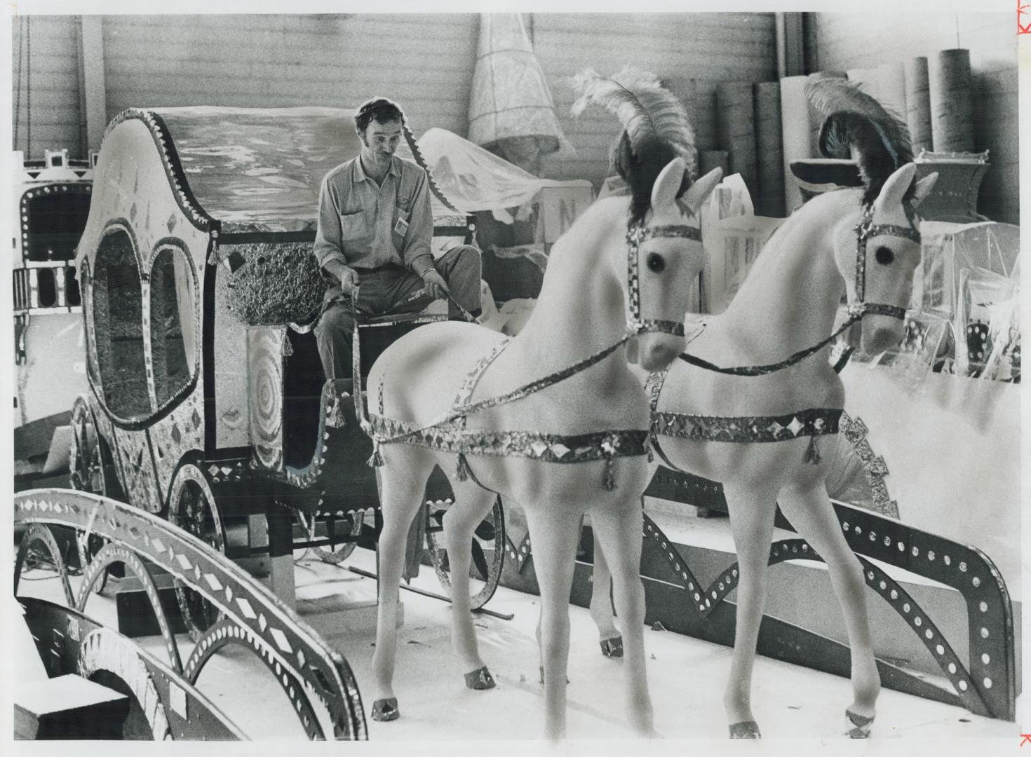 A Brand new carriage made this year for Puss 'n Boots is tested by Bob Wormald, one of the workers at the jolly fat man's Metro headquarters in Etobic(...)