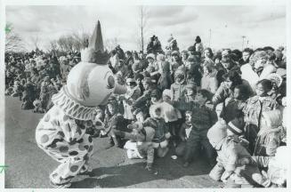 Santa's clowns shook a thousand hands as the parade moved along Bloor St