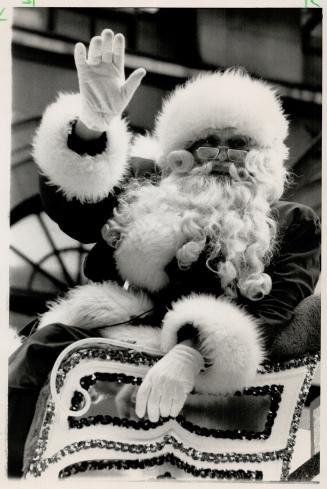 Worth The Wait: Santa waves from sleigh in his 83rd annual parade