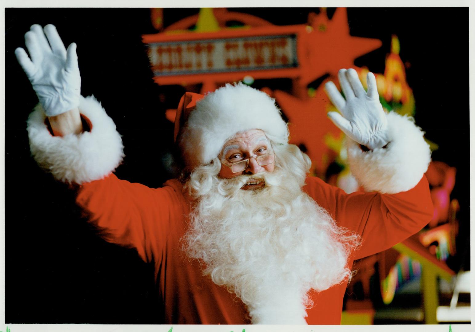 Merry old Santa practises a high wave for the hundreds of thousands expected to turn out for today's 85th annual Santa Claus Parade, which starts at C(...)