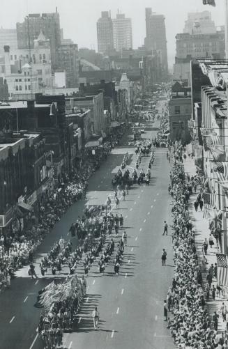 The five-hour parade of gaily dressed shrines wends its way up yonge st