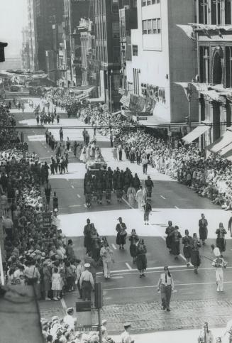 The five-hour parade of gaily dressed shrines wends its way up yonge st