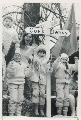 Shamrock express: Kids whoop it up on float in last year's return (after 110 green-less years) of the parade