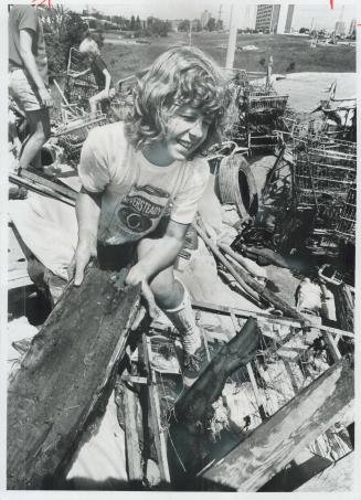 Junk cleared out of the Black Creek Ravin in the Jane-Finch area of North York is moved aside by 11-year-old Jeannette Reid, a Grade 5 pupil at Derryd(...)