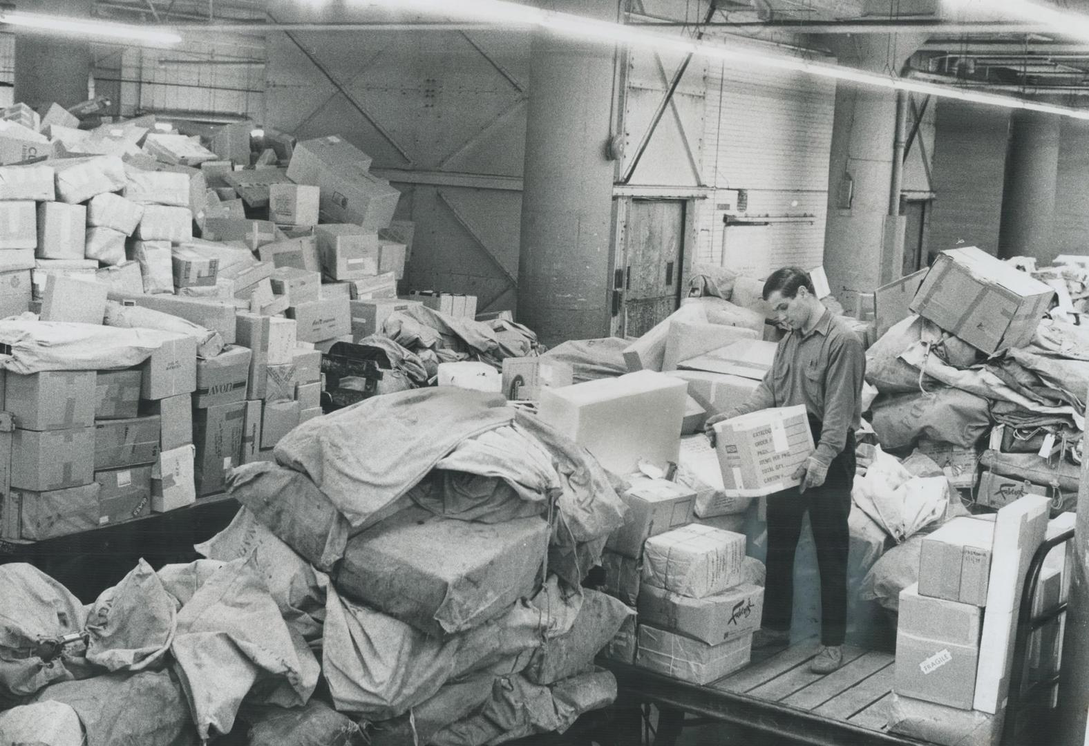 Mounting pile of mail at the main post office in Toronto is three times as bad as Christmas-any Christmas, a post office spokesman said last night. We(...)