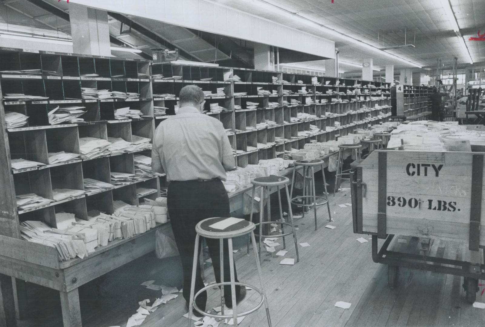 Backlog of mail that has piled up during the various rotating mail strikes in the Metro area is processed by postal workers at the main office in Toro(...)