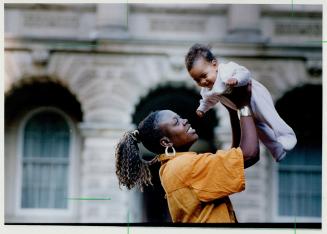 Stranded: This homeless mother and child were among a dozen families attending court yesterday