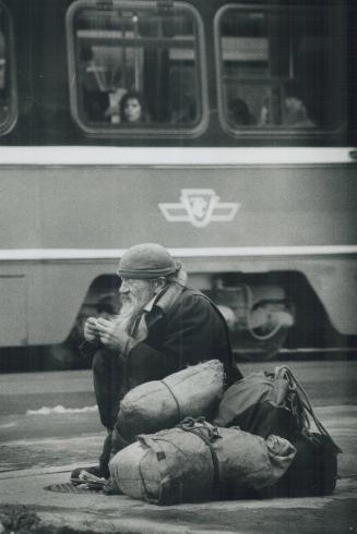 Harsh season for homeless, A homeless man known as a regular on downtown streets tries to keep warm in yesterday's -3C (26F) weather by sitting on a w(...)