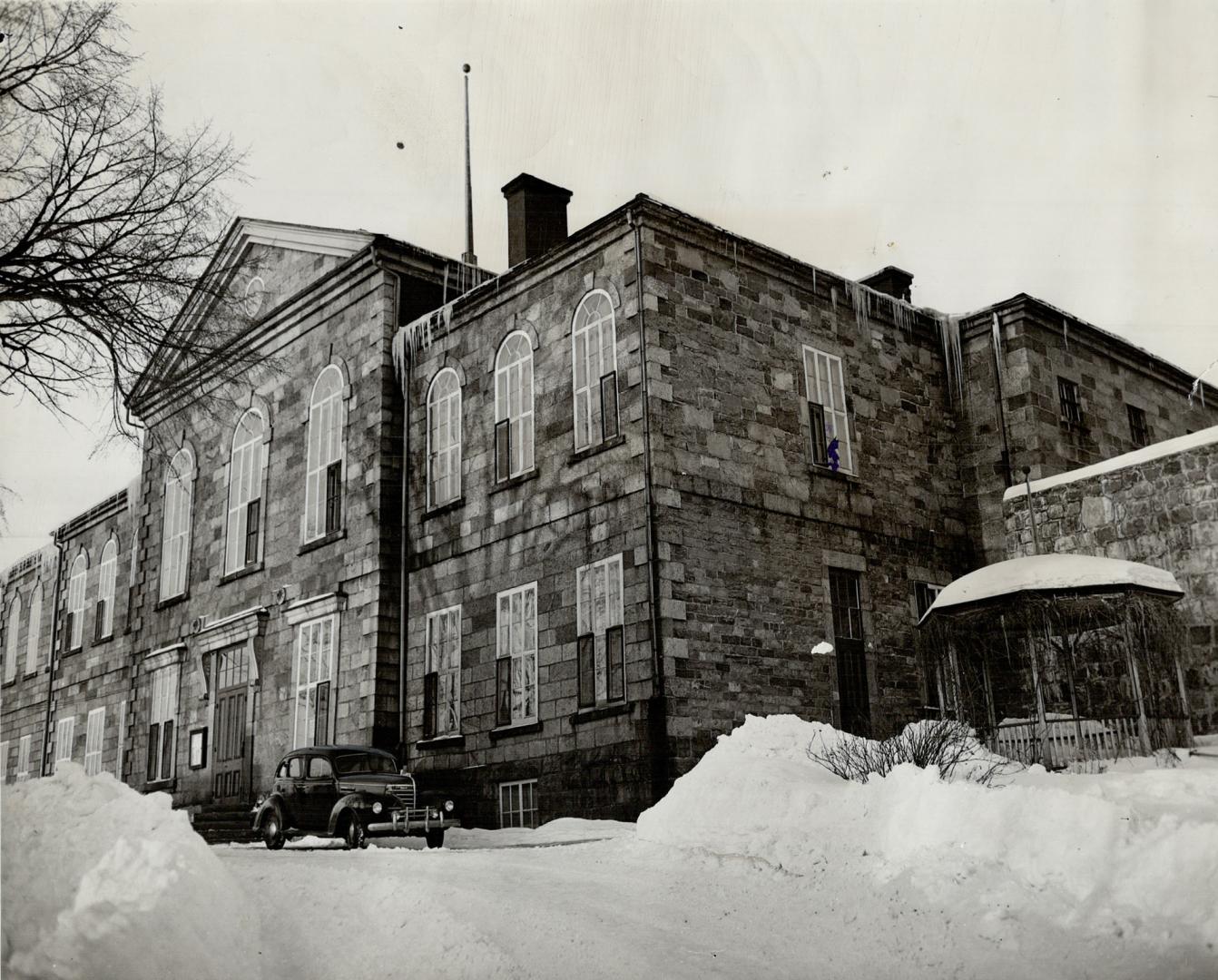 In this forbidding jail at St. Joseph de Beauce, Lucille Boucher was kept in the cell which eight years ago housed a woman who murdered her husband by a combination of arsenic, witchcraft