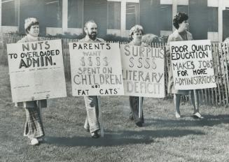 Protesting the $1 million expansion of the Halton Board of Education administration centre, now under way, four parents picket the centre, in Burlingt(...)