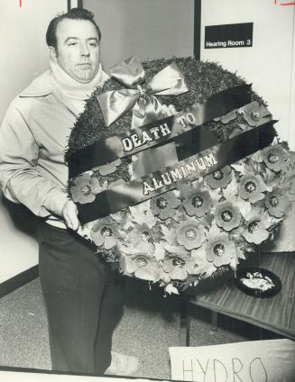 Clarence Nolan of Bramalea, Waiting outside hearing room with wreath