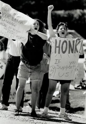 Signs of protest, Connie Russell, left, and Nicole Sandquist, both 15, protest delays in a private member's bill to allow teaching of American Sign La(...)