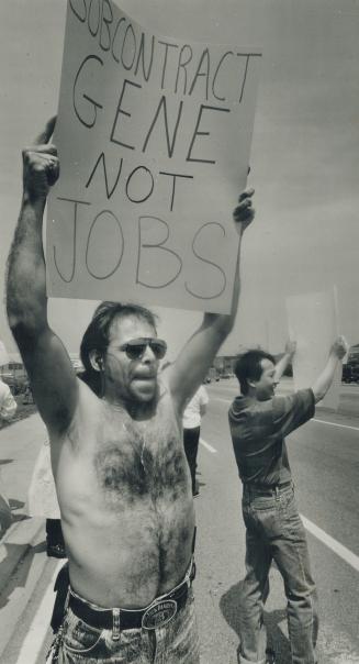 Message for boss: A McDonnell Douglas worker protesting at the Malton plant yesterday tells Gene Siddall, company head, how he feels