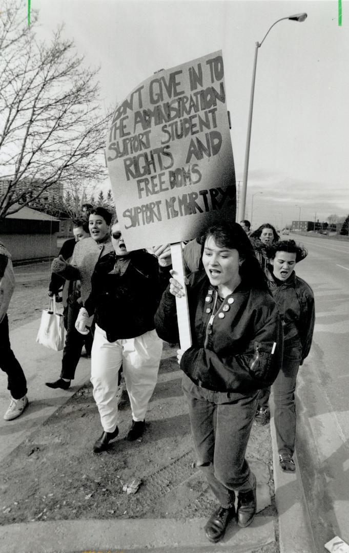 Marching for teacher: Ajax High School students demonstrate today for the reinsatement of their law teacher Jim McMurtry, who was fired last week